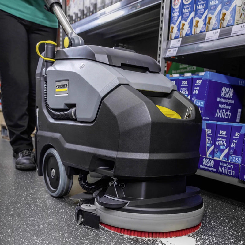 Hand pushed floor scrubber