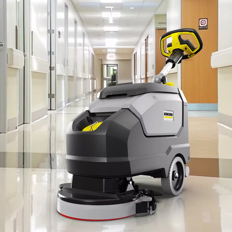 Hand pushed floor scrubber