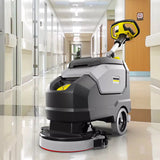 Hand pushed floor scrubber