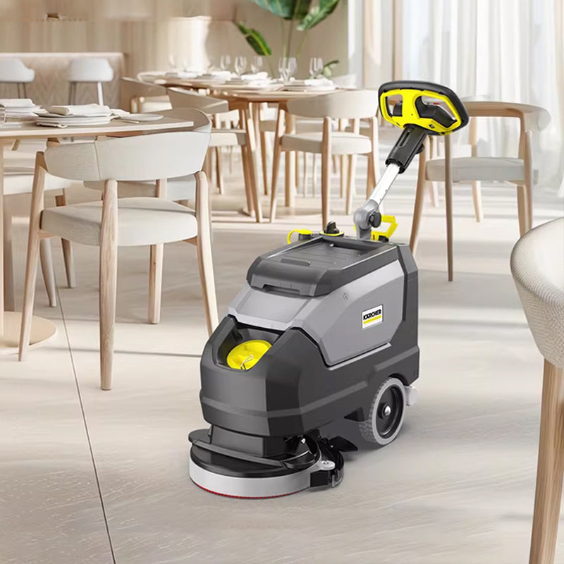 Hand pushed floor scrubber