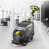 Hand pushed floor scrubber