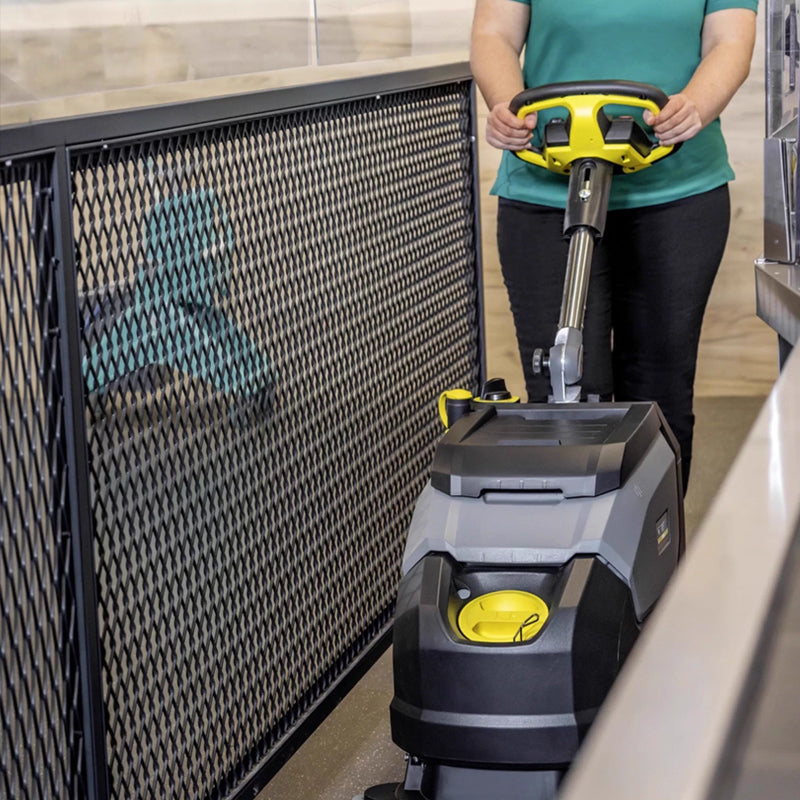 Hand pushed floor scrubber